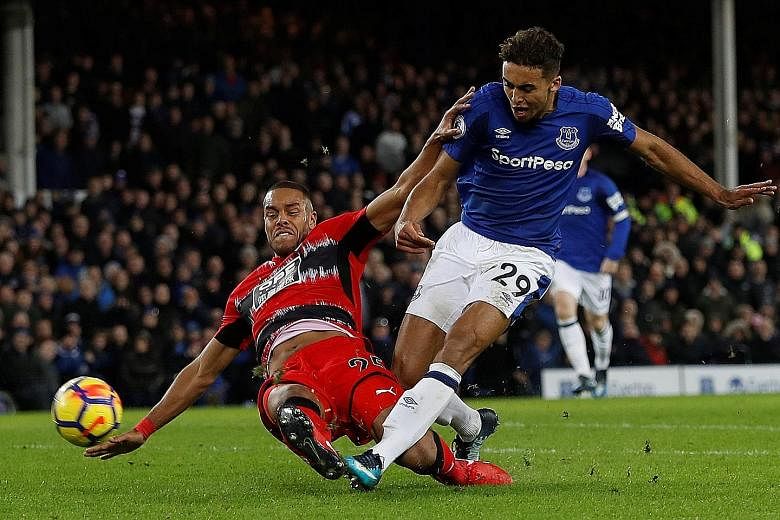 Everton's Dominic Calvert-Lewin scores their second goal in the 2-0 win against Huddersfield Town on Saturday. It was Sam Allardyce's first match in charge of the Toffees.