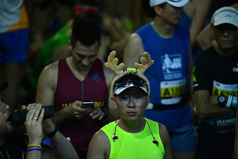 Left: One runner gets into the Christmas spirit a little earlier this year. Right: Another runner prepares for a well-earned body rub having completed his race exertions. Above: A gentleman who came dressed for the occasion, Nguyen Som Nam completed 