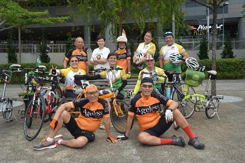 Above: (front row, from left) Ageless Bicyclists' Mr Malcolm Chen, 72, with volunteers Ivan Lim, 55, (second row, from left) Patsy Lim, 63, Lee Geok Yian, 62, John Cheng, 80, (back row, from left) David Leong, 64, Justine Sim, 45, K.C. Au Yeong, 66, 
