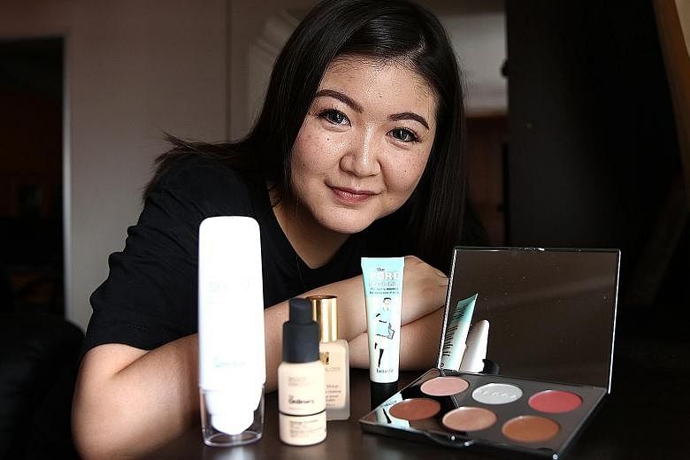 University student Jean Lee with some of the items she bought during Black Friday sales last month. The 21-year-old spent over $300 on clothes and make-up