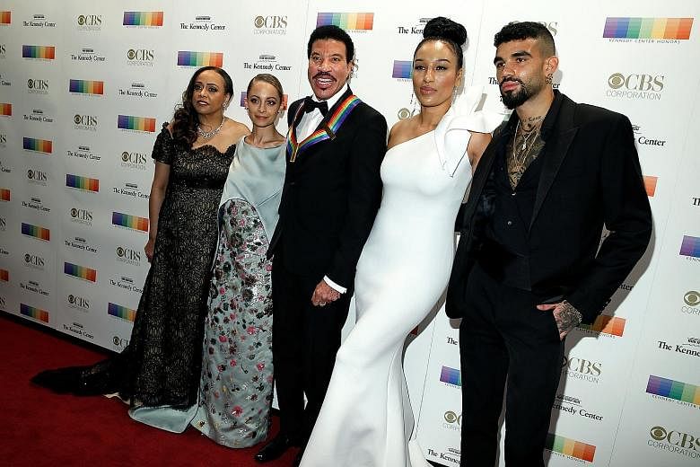 Singer Lionel Richie (centre), with his family, was one of the honourees at the Kennedy Center Honours.