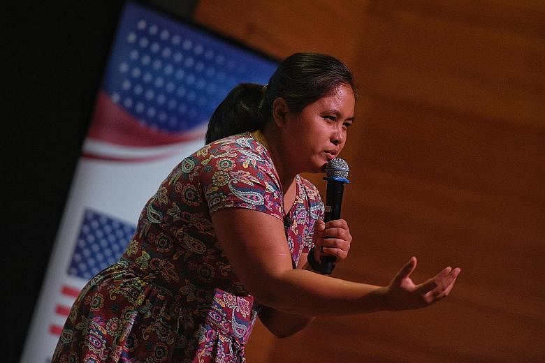 Runner-up Naive L. Gascon from the Philippines recites her poem, And Again, at the annual Migrant Worker Poetry Competition at National Gallery Singapore on Sunday.