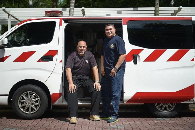 Emergency responders Syed Abdillah Alhabshee (left) and Mohamad Fuad Abdul Aziz reacted quickly when they saw a taxi engulfed in flames.