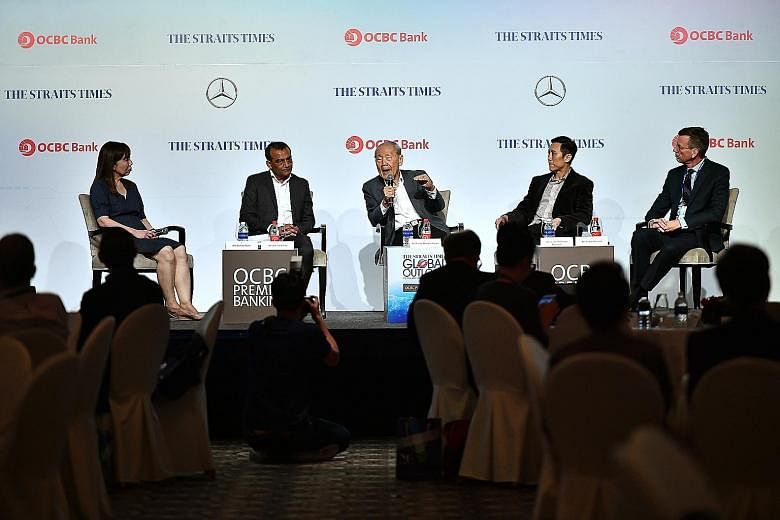 Taking the stage at The Straits Times Global Outlook Forum yesterday were (from left) Ms Audrey Quek, moderator and ST opinion editor; Mr Rahul Pathak, ST associate editor; Professor Wang Gungwu, chairman of the ISEAS - Yusof Ishak Institute and NUS'