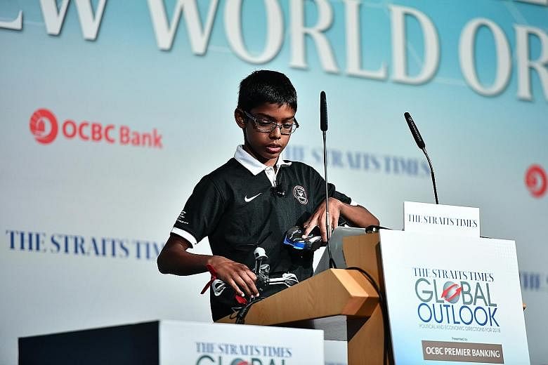 Reuben Paul, the opening speaker at The Straits Times Global Outlook Forum yesterday, giving a demonstration on how easily devices linked to the Internet of Things can be hacked. The 11-year-old from Texas is sought after across the world for his hac