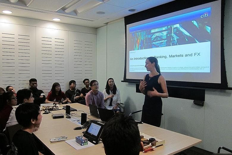 Ms Joyce Skidell, Citi Singapore's lead for its "e for Education" campaign, speaking to students from ITE College East about the world of markets and forex trading. The campaign has raised US$6.25 million (S$8.4 million) this year and around US$22.5 
