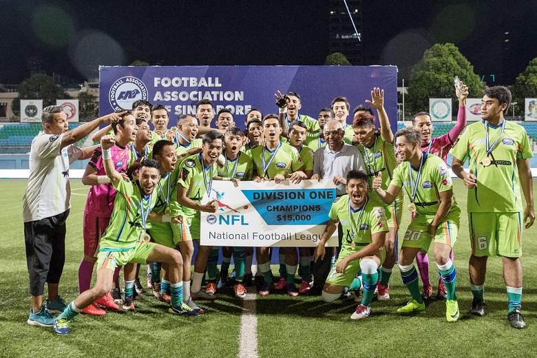Players and staff from Yishun Sentek Mariners celebrating their NFL Division 1 title win. The walkover was an anti-climactic end to a tight two-way race.