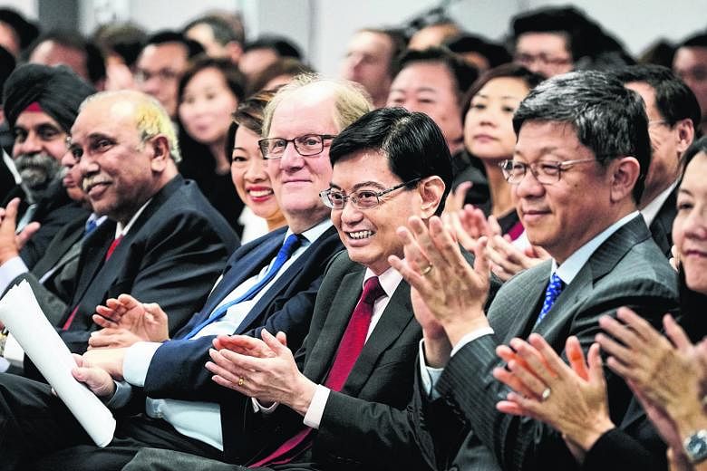 Finance Minister Heng Swee Keat (centre) seated between NTU President Bertil Andersson and Mr Robin Hu, Head, Sustainability and Stewardship Group, Temasek. Seen next to Mr Andersson is Ms Foo Mee Har, CEO of the Wealth Management Institute at NTU, w