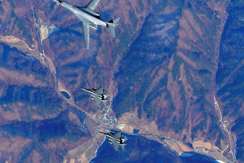 US Air Force B-1B Lancer bomber (centre) flying over South Korea with other US and South Korean fighter jets during a joint military drill in a photo released by the South Korean Defence Ministry on Wednesday.