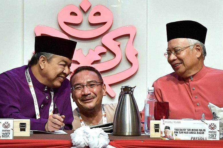 From left: Umno's deputy president Ahmad Zahid Hamidi, vice-president Hishammuddin Hussein and president Najib Razak during the Umno General Assembly in Kuala Lumpur yesterday.