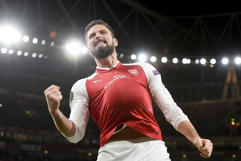 Arsenal striker Olivier Giroud celebrating putting away his spot-kick during Thursday's 6-0 Europa League hammering of Bate Borisov. They are 15 points behind EPL leaders Manchester City.