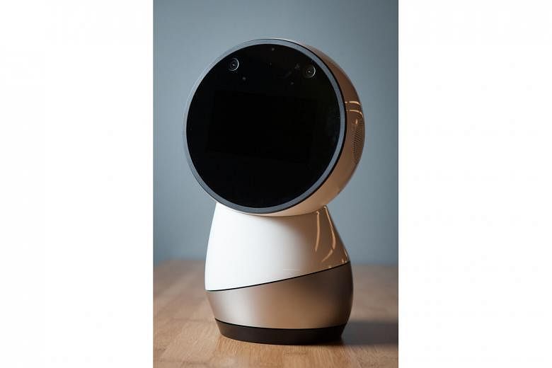 Jibo's face is a touchscreen with one white eye that looks around, blinks and even closes when he gets bored with you.