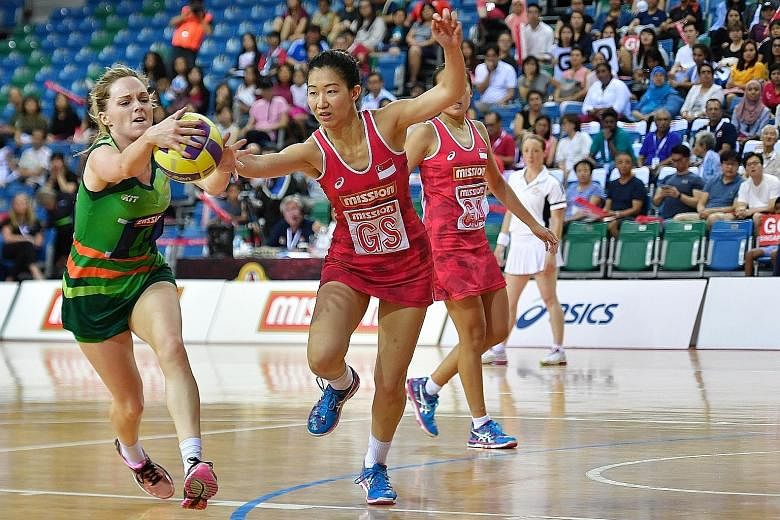 Ireland's Kristy Owens squaring off with Singapore's Charmaine Soh in the match for third place yesterday. Singapore won 60-41.