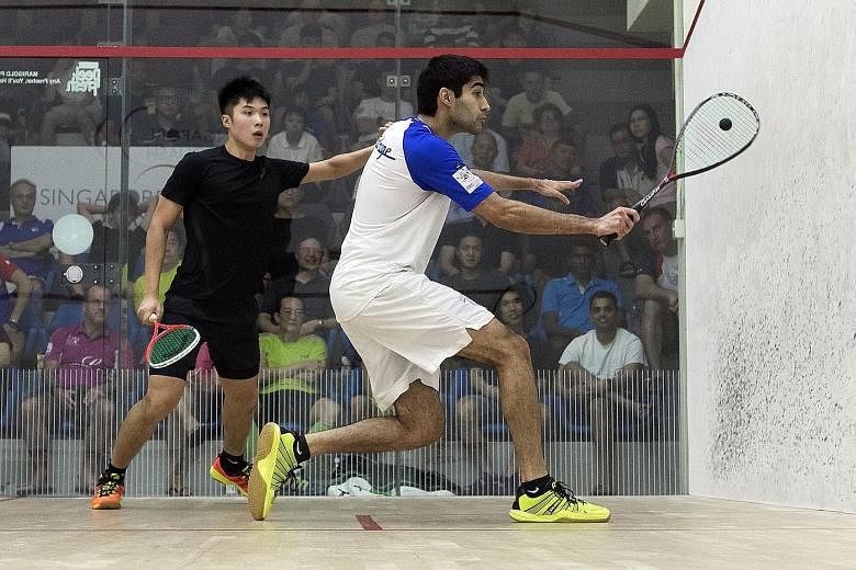 India's Ramit Tandon (right) upset top seed Henry Leung of Hong Kong 11-3, 11-6, 11-5 yesterday in the semi-finals of the Professional Squash Association Men's Challenger 5 event at the Singapore Squash Open. The sixth seed faces Chinese Taipei's Jam