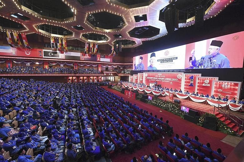 Prime Minister Najib Razak delivering his closing speech to Umno delegates at the end of the five-day general assembly yesterday. A resolution was passed last Friday ensuring Datuk Seri Najib and Deputy Premier Ahmad Zahid Hamidi would be unopposed a