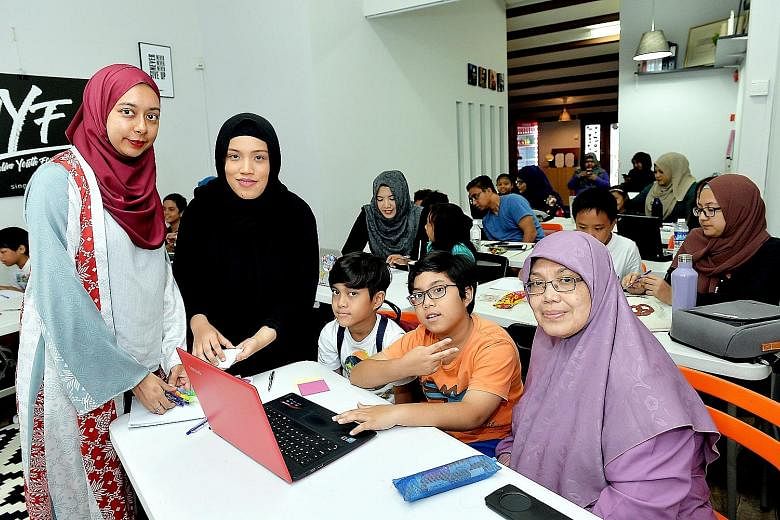 From left: Ms Nurul Jihadah Hussain, founder of The Codette Project, trainer Nurhuda Rafi Ang and course participants.