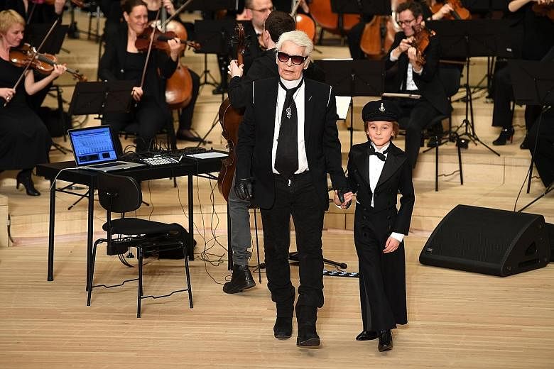 Karl Lagerfeld (above left) unveiled his 15th Metiers d'Art collection for Chanel - featuring bejewelled Elbesegler sailor caps (above right), among other things - at the Elbphilharmonie (right) in Hamburg.