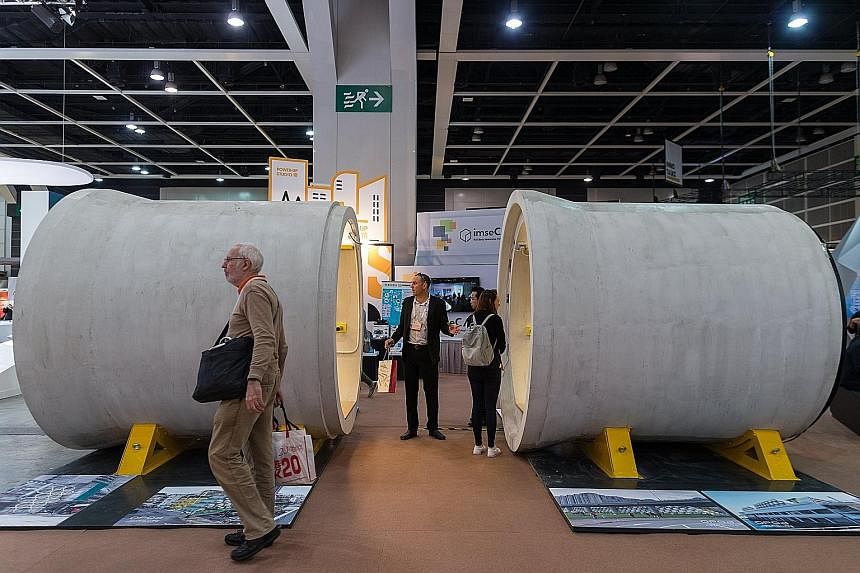 A man's home is his castle, be it a mansion or, in this case, OPod. Mr Jonathan Kong (above), a designer director at James Law Cybertecture, shows how anyone may be ruler of his own space inside the OPod Tube House, which was displayed at the DesignI