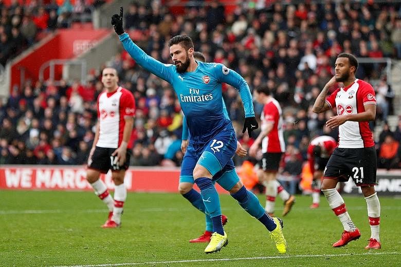 Arsenal's Olivier Giroud celebrates after scoring the 88th-minute equaliser in the 1-1 draw against Southampton yesterday.
