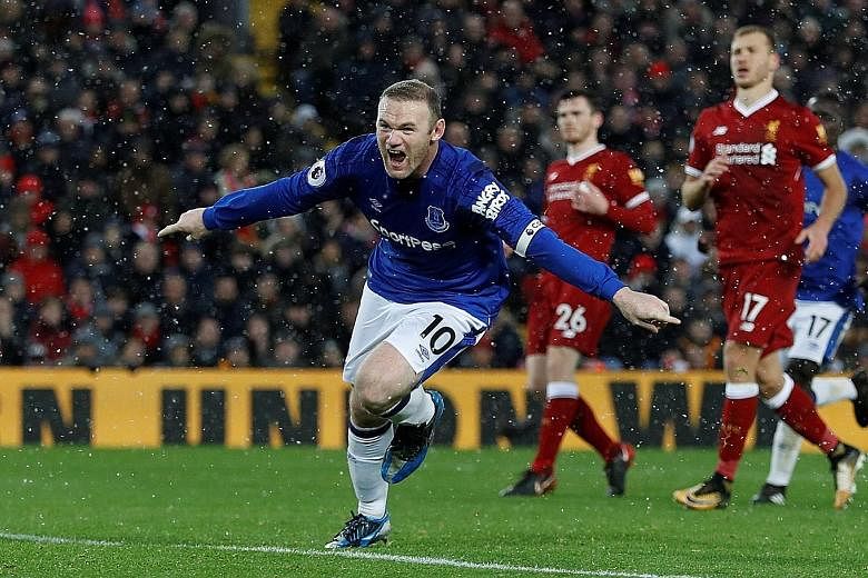 Everton captain Wayne Rooney cannot hide his joy after scoring his first Merseyside derby goal via a penalty to rescue a point for the Toffees. The 1-1 draw extends Everton's unbeaten start under new boss Sam Allardyce.