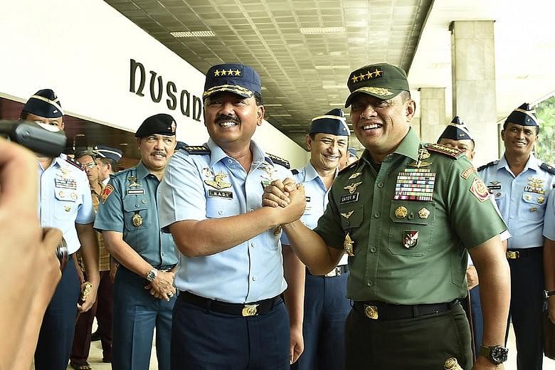 Air Chief Marshal Hadi Tjahjanto (left) has been sworn in as Indonesia's new armed forces chief, taking over from General Gatot Nurmantyo, who will reach the official retirement age of 58 in March next year.