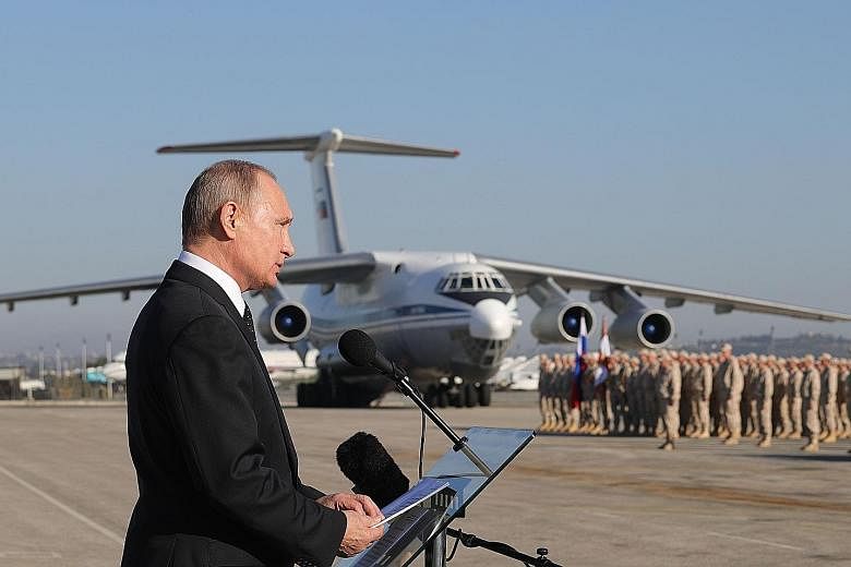 President Vladimir Putin addressing Russian troops in Syria yesterday, saying Moscow had succeeded in keeping Syria intact as a "sovereign independent state".