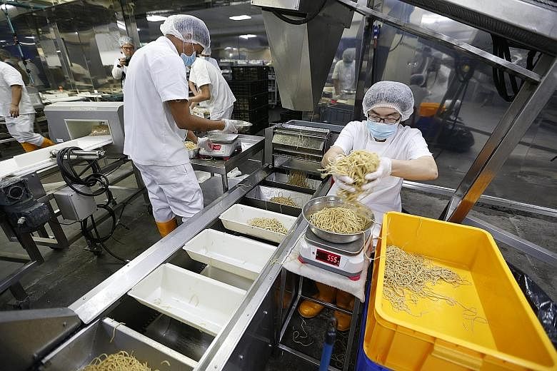 Wholemeal noodles being weighed at Leong Guan Food Manufacturer's factory before being packaged.