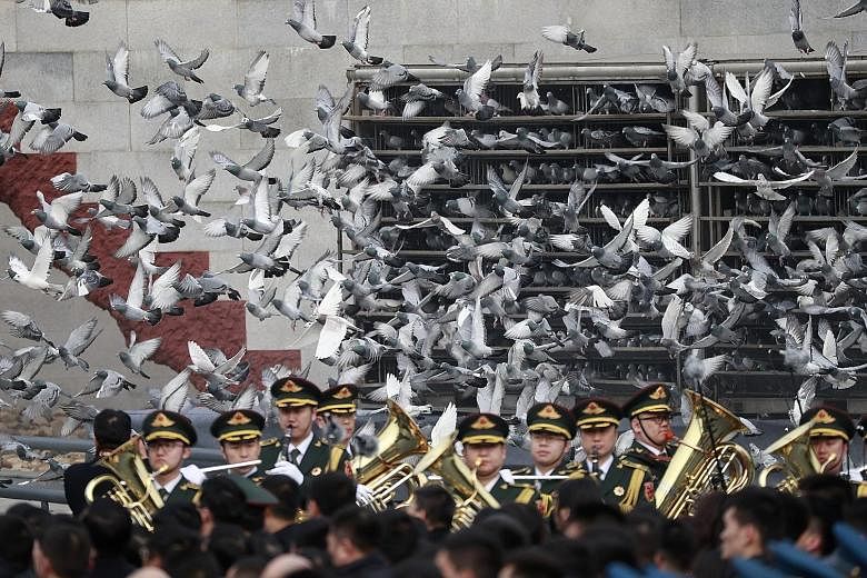 Birds being released during a ceremony in Beijing yesterday to mark the 80th anniversary of the Nanjing Massacre.