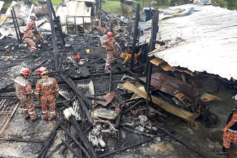 Four people died in a fire that destroyed their wooden house in Selangor. Initial investigations found that a flammable object had been thrown into the house and the family car had exploded.