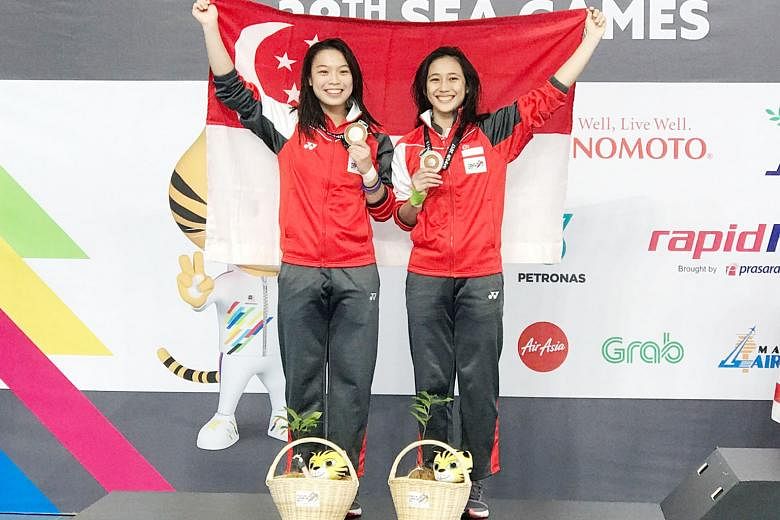 Singapore's 3m springboard synchronised duo of Ashlee Tan (left) and Fong Kay Yian after winning SEA Games silver in Kuala Lumpur in August. A failed drug test has elevated them to champions.