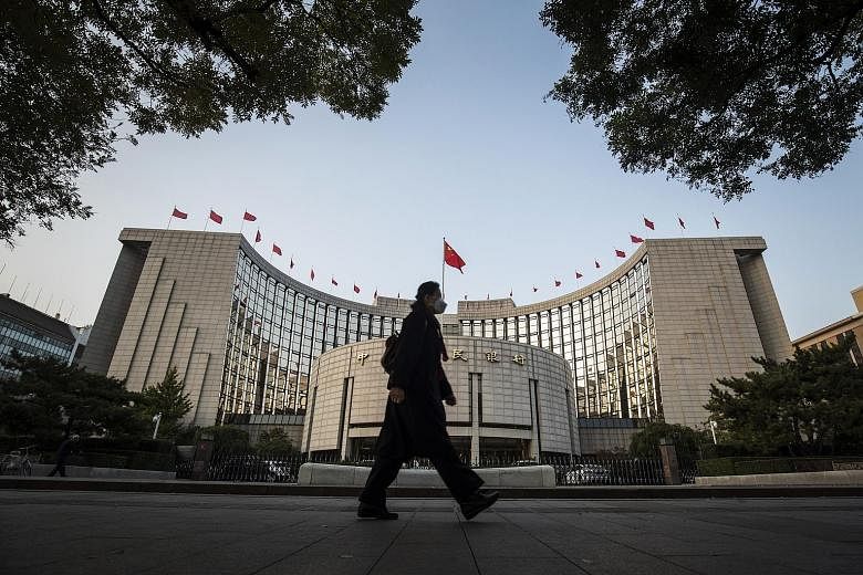The People's Bank of China in Beijing. China's economy has started to cool amid a government crackdown on high-risk lending and polluting factories, and the latest move by the central bank signalled that Beijing will keep policy tighter next year.