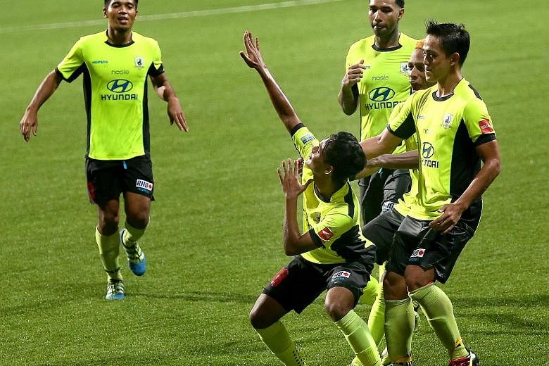 Saifullah Akbar's Tampines team-mates celebrating with him after the then 17-year-old scored in a Singapore Cup match last year. He is glad for the new rule that S-League clubs must start with at least three Under-23 players in each game, so that you