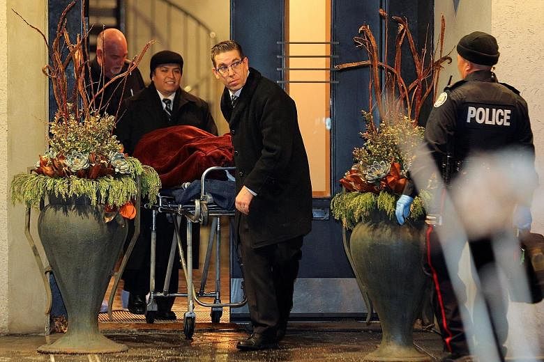 One of two bodies being removed on Friday from the home of pharmaceutical firm Apotex founder Barry Sherman and his wife, Honey. Police say the circumstances of their deaths were "suspicious".