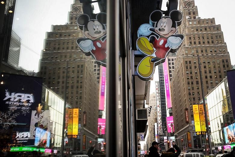 An image of Mickey Mouse outside the Disney Store in Times Square, New York. Disney is doubling down on broadcast and cable with the Fox acquisition.