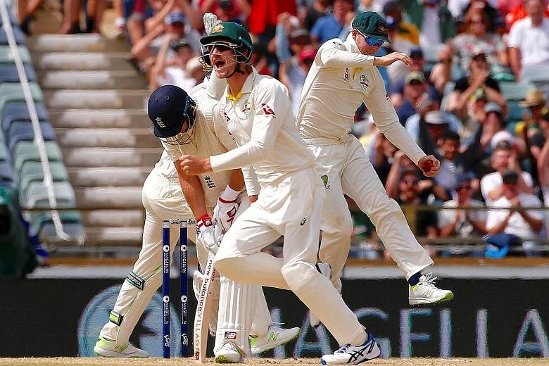 Australia captain Steve Smith (extreme right) celebrating with team-mates after taking a catch to dismiss his England counterpart Joe Root on the fourth day of the third Ashes cricket Test in Perth. Only rain is likely to help the visitors rescue a d