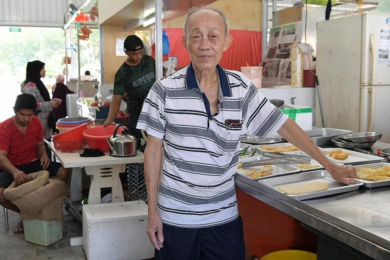 Yong tau foo seller Neo Chwee Eng says he now gets around 60 customers a day at the temporary market, fewer than half of what he used to see.