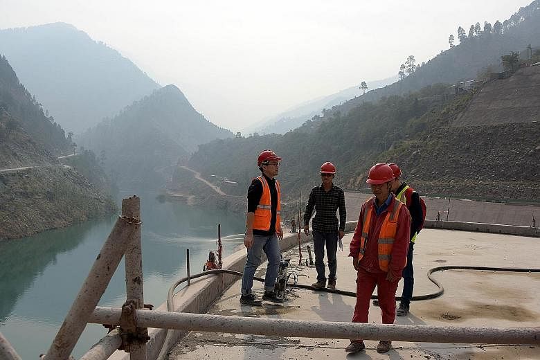 Chinese engineers working on the Neelum-Jhelum Hydropower Project in Nosari, on Oct 31 on the Pakistan side of Kashmir's Neelum Valley.