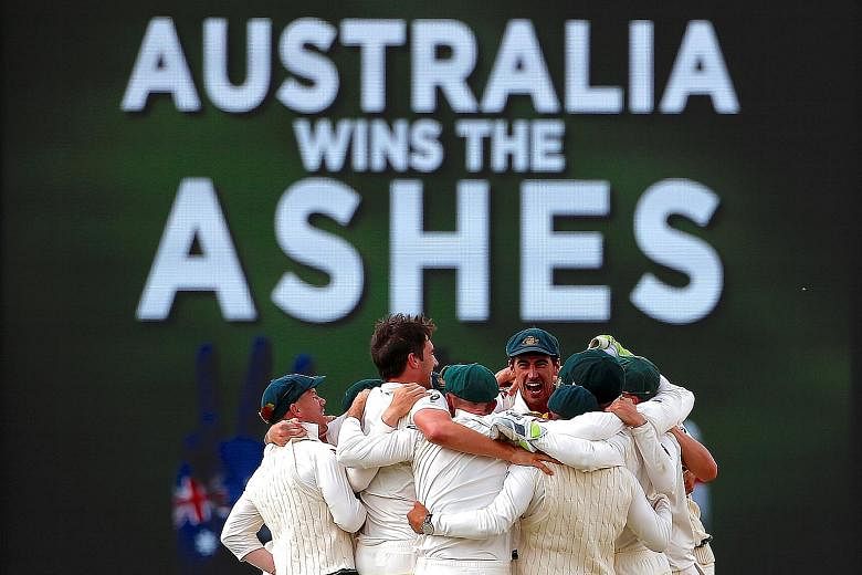 Left: Australian players celebrate regaining the Ashes after winning the third Test in Perth - the final Ashes Test to be played at the Waca Ground in Perth. Below: The writing is on the wall when England's Jonny Bairstow is bowled for 14 with the ve