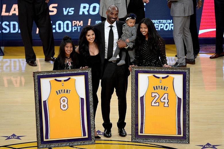 Kobe Bryant with his family during the half-time ceremony, where both his LA Lakers numbers were retired at Staples Centre.