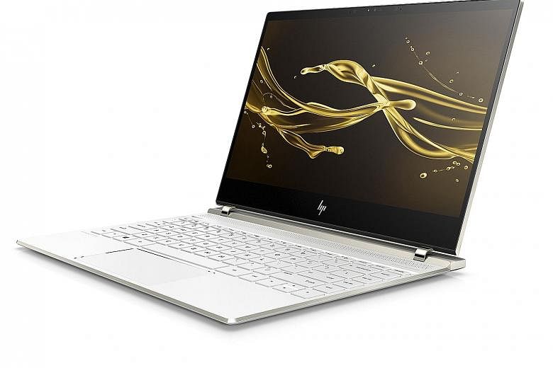 With slim hinges supporting the lid, the HP Spectre 13's display almost pulls off the illusion of a screen floating in mid-air.