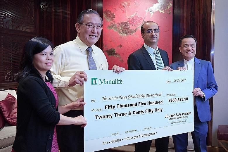 (From left) ST School Pocket Money Fund general manager Tan Bee Heong and Charity Council chairman Gerard Ee receiving the cheque from Manulife Singapore president and CEO Naveed Irshad and JS Jireh branch director James Sim at yesterday's luncheon.