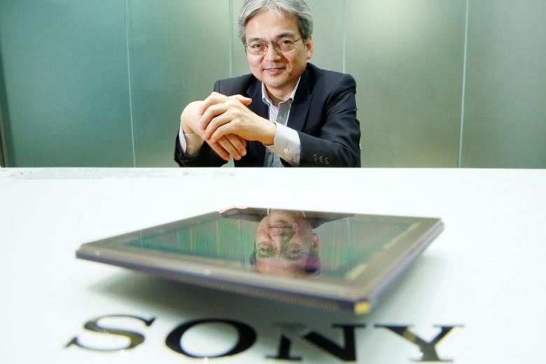 Mr Teruo Hirayama, technology chief of Sony's chip business, with the company's image sensor which has proved to be a winner.