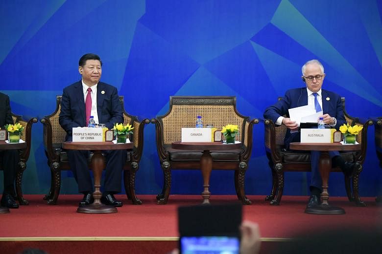China's President Xi Jinping and Australian Prime Minister Malcolm Turnbull at the Apec meeting in Danang, Vietnam, last month. The Turnbull government has moved to revamp the country's espionage and foreign influence laws. The draft laws would ban f
