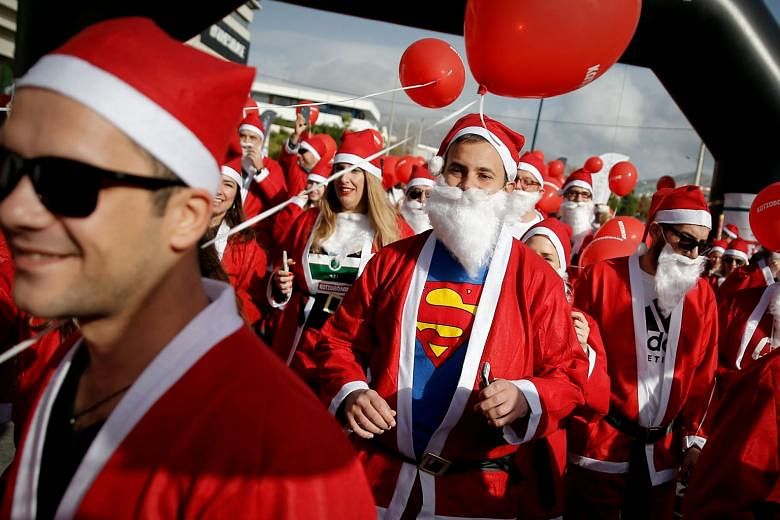 People dressed as Santa Claus taking part in a Santa Claus Run in Athens, Greece, last week.