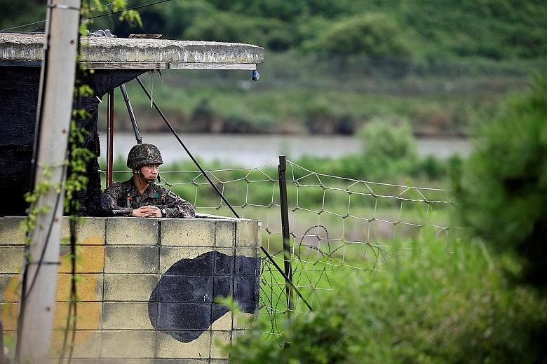A South Korean soldier at a guard post near the minefield-littered Demilitarised Zone separating the two Koreas in Paju, South Korea.