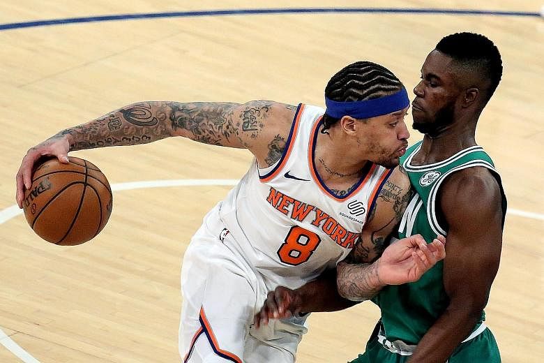 New York Knicks forward Michael Beasley driving against Boston Celtics forward Semi Ojeleye in their NBA match at Madison Square Garden in New York on Thursday. The Knicks won 102-93.