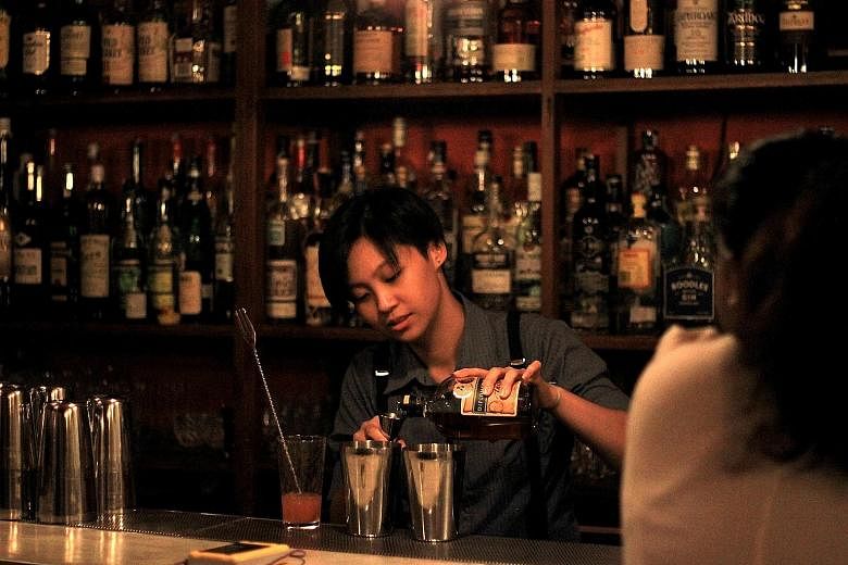 Young urbanites are willing to splash out on cocktails made by artisan bartenders at speakeasies such as Omakase + Appreciate (above), one of the first such bars in Malaysia.
