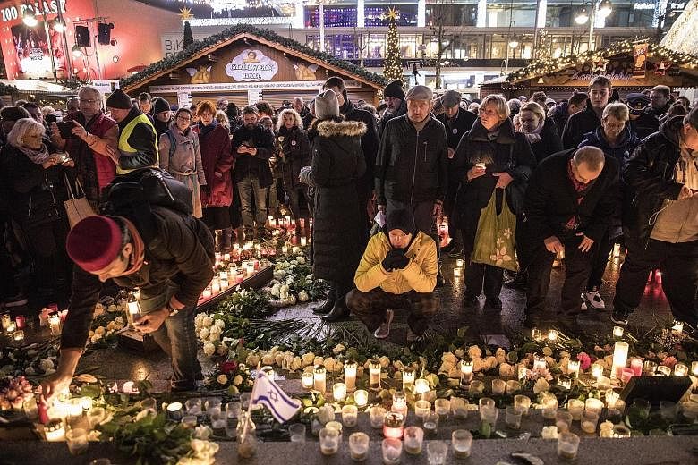 Visitors at a memorial event on Tuesday marking the first anniversary of the terrorist attack on the Christmas market in Berlin. 