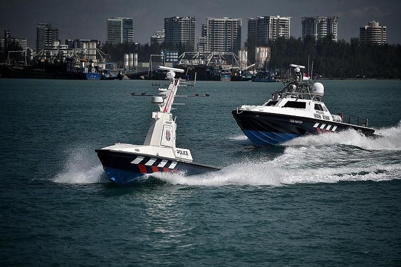 The Police Coast Guard's unmanned surface vessels look like ordinary patrol boats but are loaded with cameras, radar, sensors, search lights and loud-hailers.