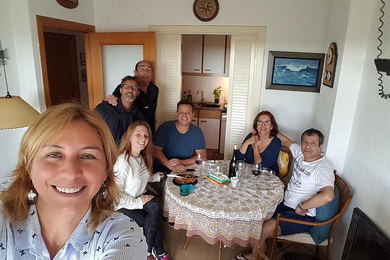 Mr Felix Bonet Nieto (in white T-shirt) with his family back home in Barcelona. Mr Bonet is upset by the majority of pro-independence groups after last Thursday's vote in Catalonia to elect a new regional Parliament.